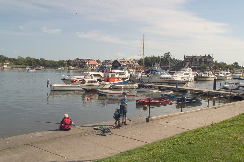 RM-0020 
 Fishing at Oulton Broad, Suffolk 
 Keywords: Fishing Oulton Broad Boats Walkways Suffolk Clouds Lakes Moorings