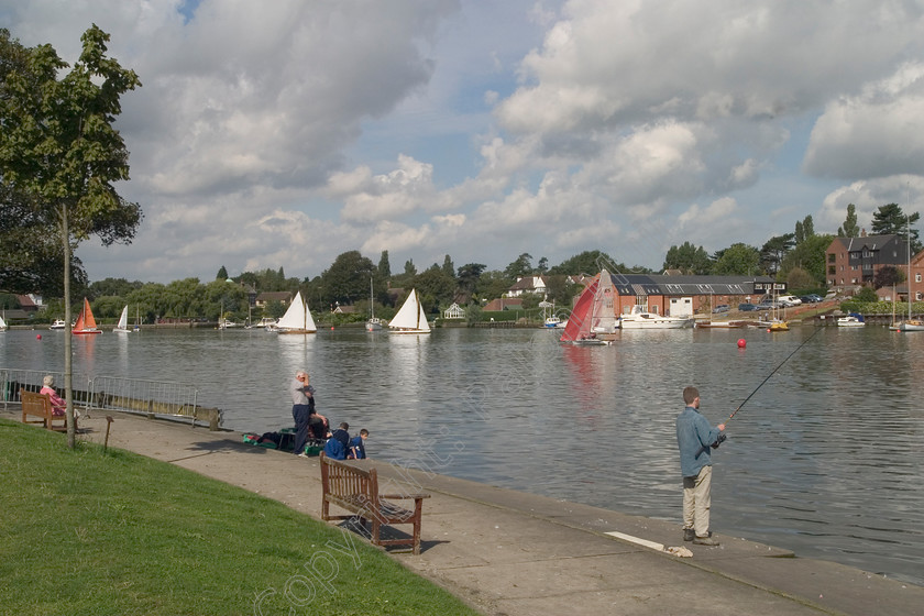 RM-0025 
 Oulton Broad, Suffolk 
 Keywords: Oulton Broad Fishing.Sailing Boats Walkways Suffolk Clouds Lakes People